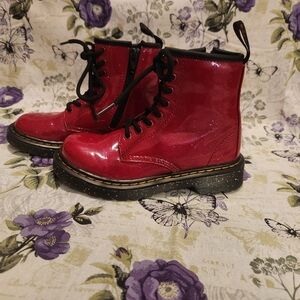 Dr. Martens Junior 1460 Cosmic Glitter Lace Up Boots in red.